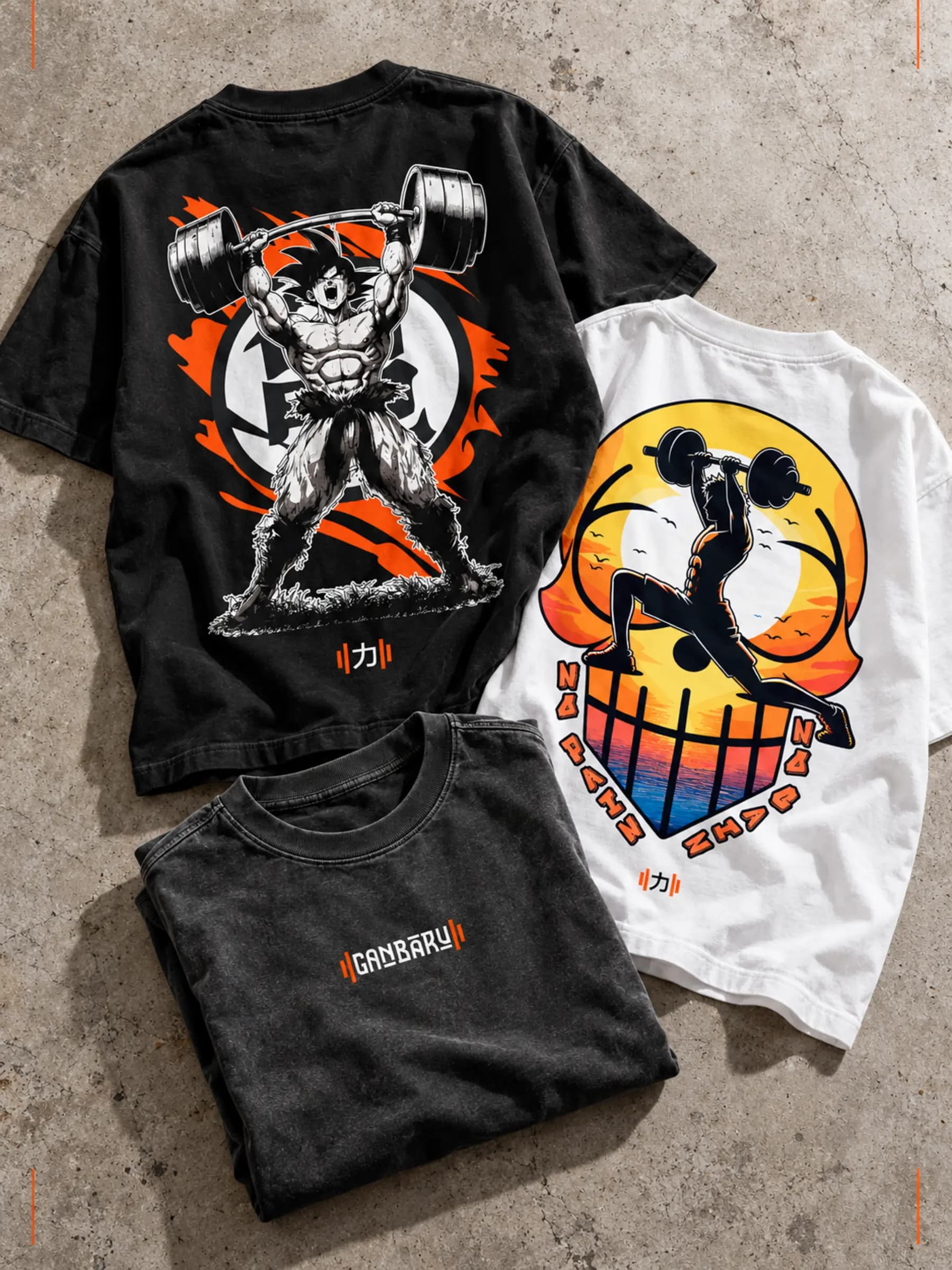 Poleras Ganbaru negra y blanca, con la gráfica del drop.